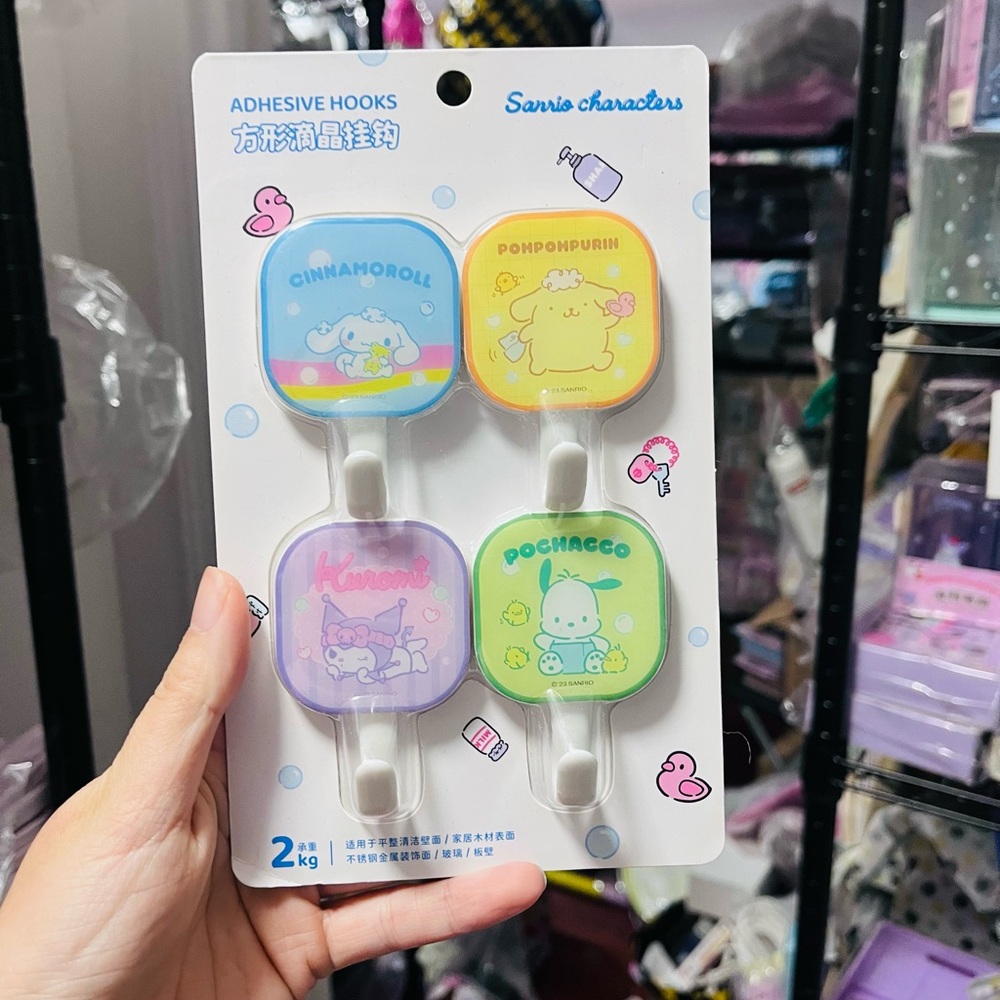 4 pcs sanrio characters adhesive hooks.